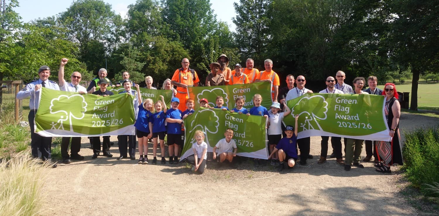 Green Flag Award winners celebrating together in a park
